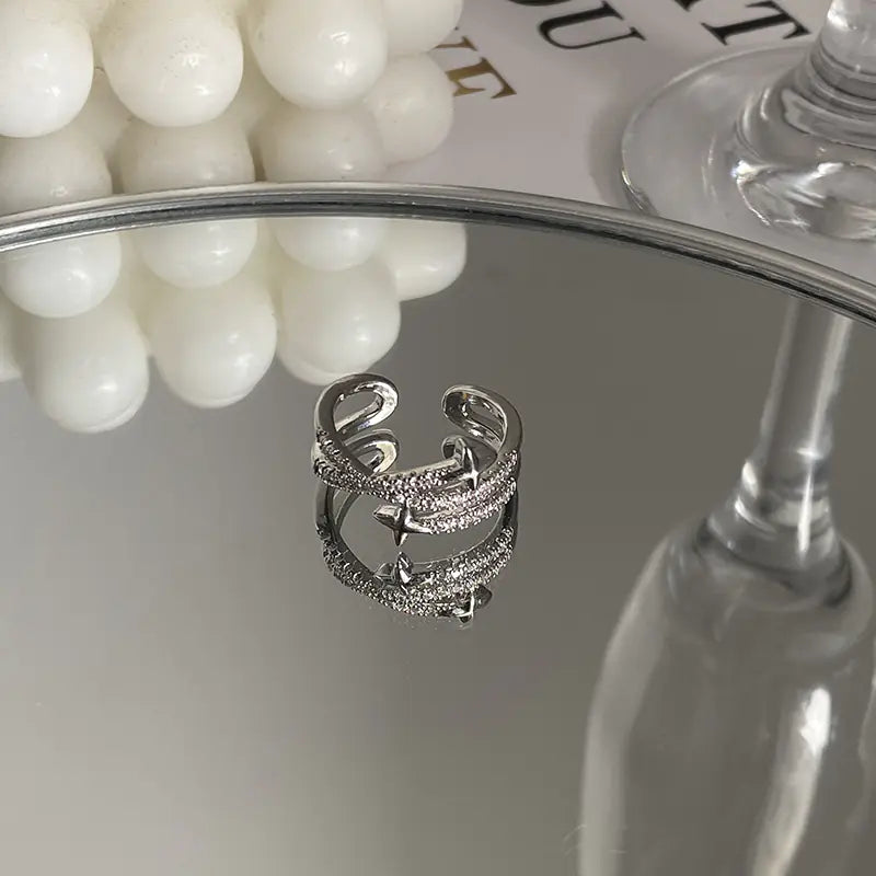 Gyönyörű cirkonkeresztes aszterizmus gyűrű