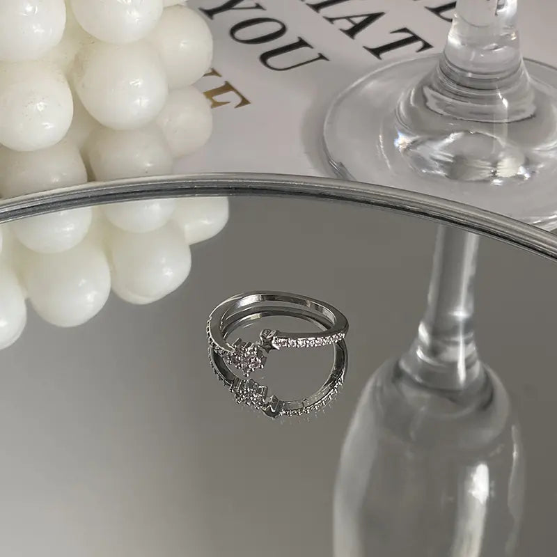 Gyönyörű cirkonkeresztes aszterizmus gyűrű